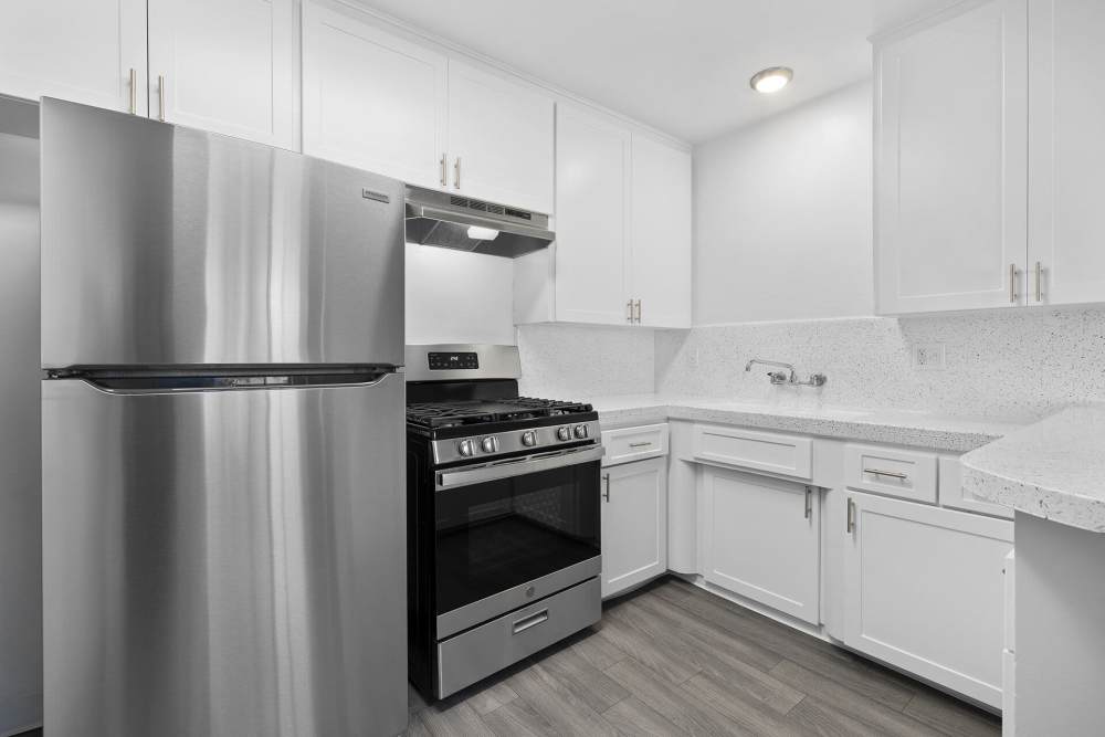 Kitchen with stainless-steel appliances at Terre at Mollison in El Cajon, California