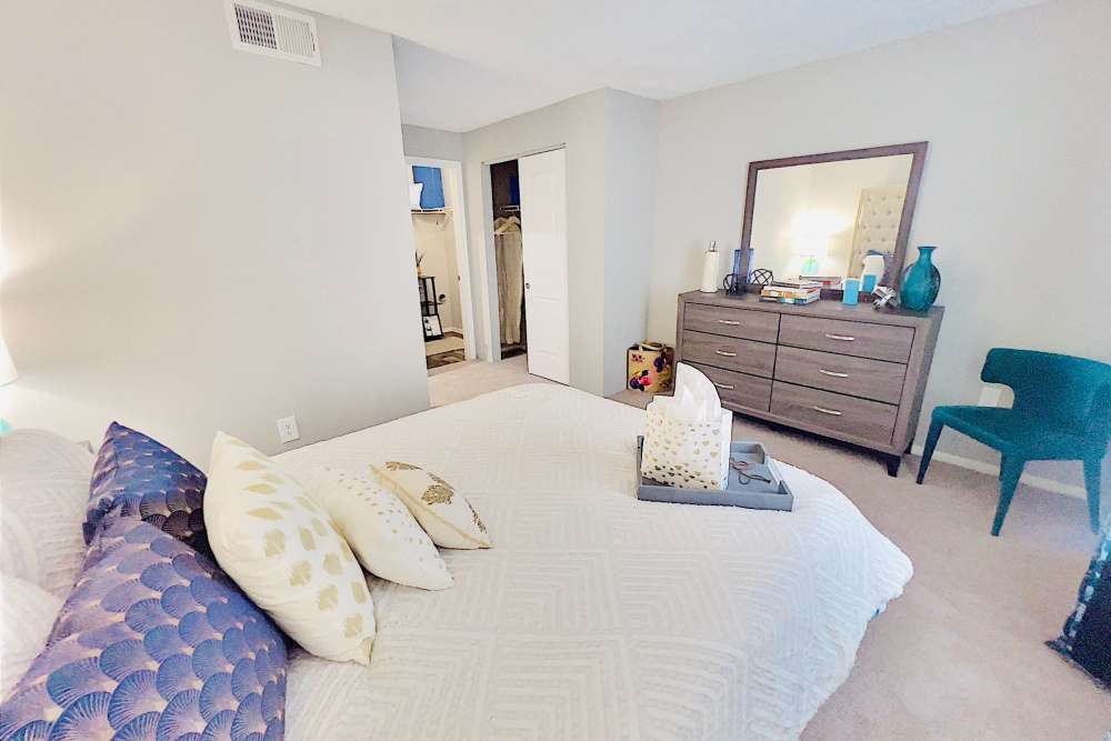 Model bedroom with white sheets at Latitude 28 in Altamonte Springs, Florida