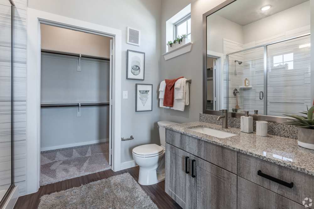 Bathroom with walk-in closet at The Trails at Summer Creek in Fort Worth, Texas