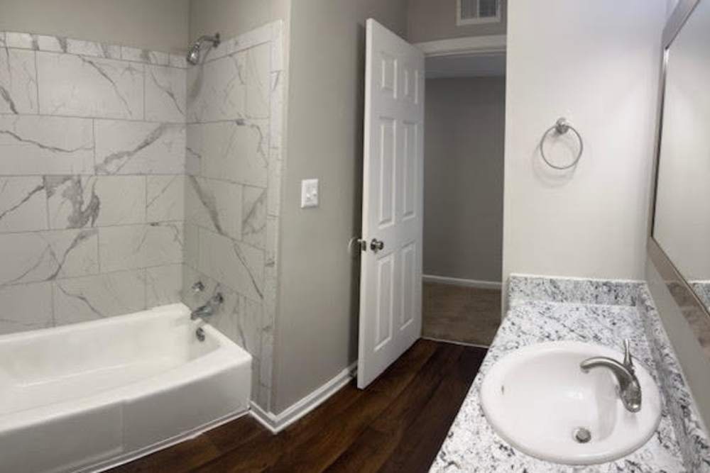 View of vanity and shower bathroom at Patrician Terrace Apartment Homes in Jackson, Tennessee