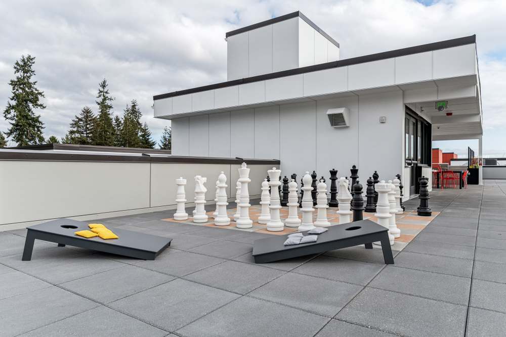 Cornhole and Chess games on the roof deck at Traxx Apartments in Mountlake Terrace, Washington 