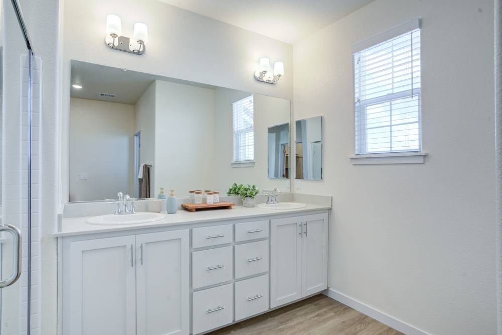 Bathrooms with white-colored furnishing at The Terraces at Stanford Ranch II in Rocklin, California