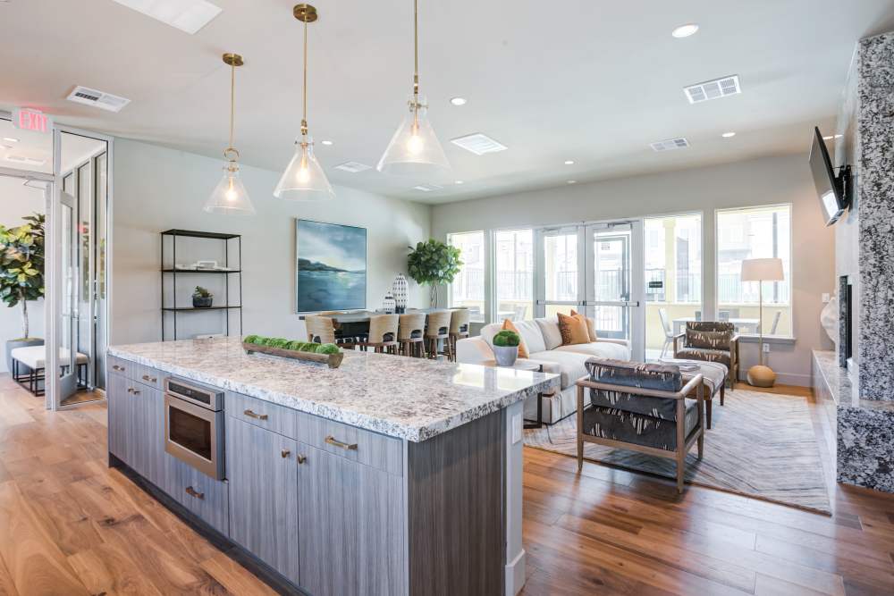 Living area next to a kitchen island at The Terraces at Stanford Ranch II in Rocklin, California