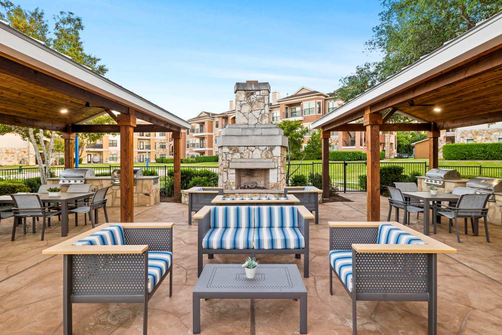 Beautiful BBQ Area & Outdoor Lounge by the swimming pool at Onion Creek Luxury Apartments in Austin, Texas