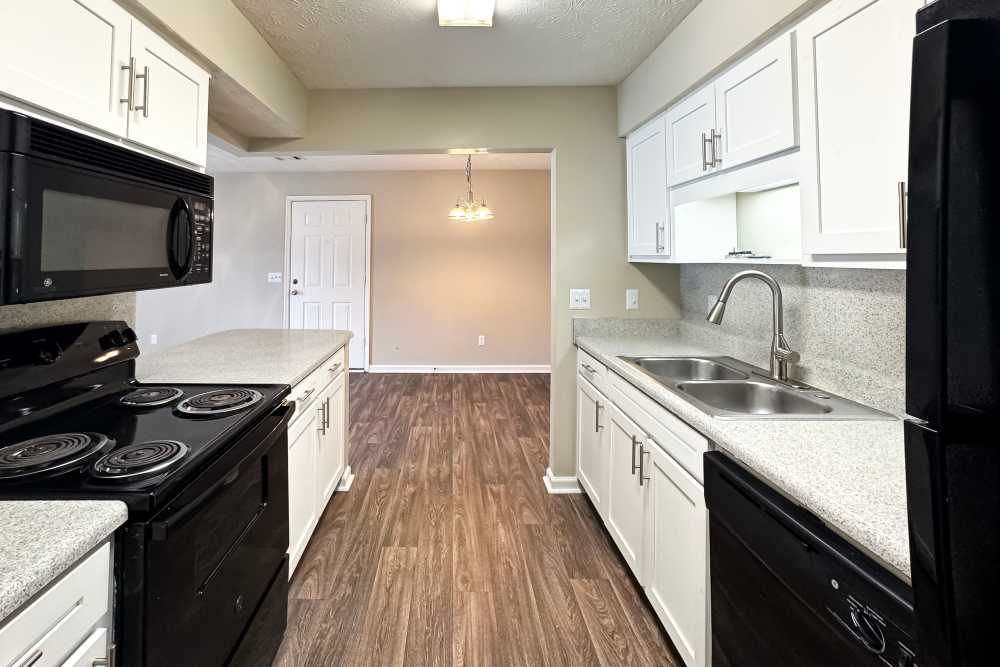 Fully-equipped cooking area at Greenleaf Apartments in Phenix City, Alabama