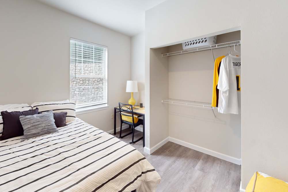 Apartment bedroom with closet at The Quarters at Columbia in Columbia, Missouri