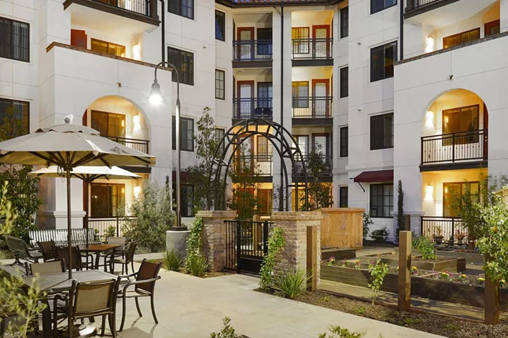Back view of the apartment with courtyard at Olivera Senior Apartments in Pomona, California
