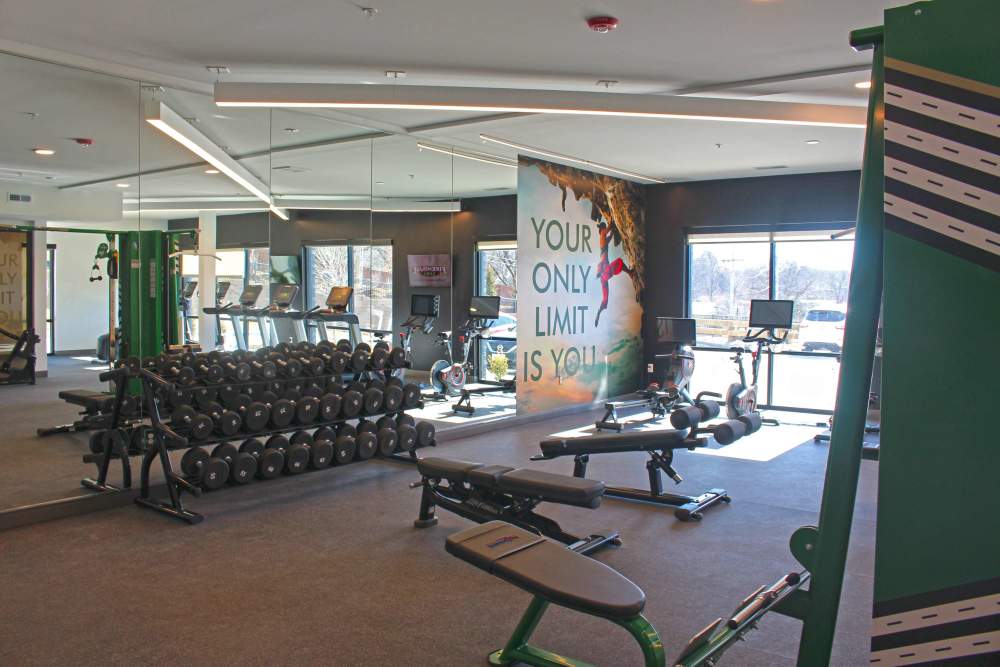 Fitness center with free-weights at The Flats at Dorsett Ridge in Maryland Heights, Missouri