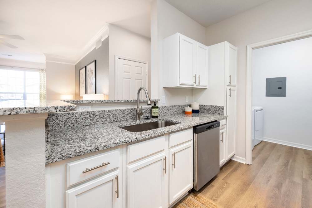 Granite countertops in an apartment kitchen at Arbors at Cahaba River in Birmingham, Alabama