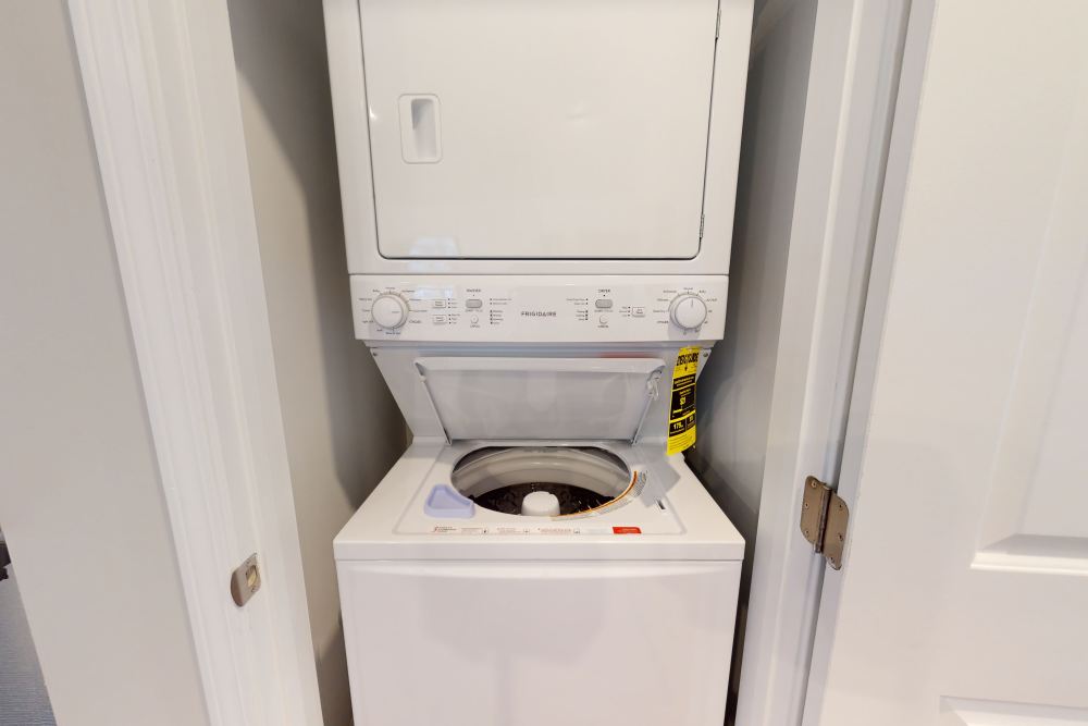 In-home washer and dryer in a model home at Coastal Club Apartments in Brunswick, Georgia