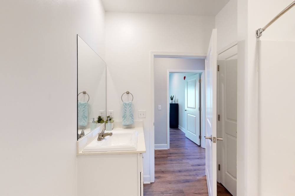 Entryway to bathroom in a model home at Coastal Club Apartments in Brunswick, Georgia