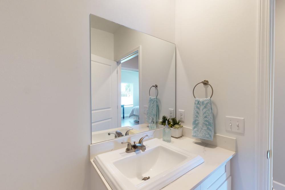 Bathroom vanity in a model home at Coastal Club Apartments in Brunswick, Georgia