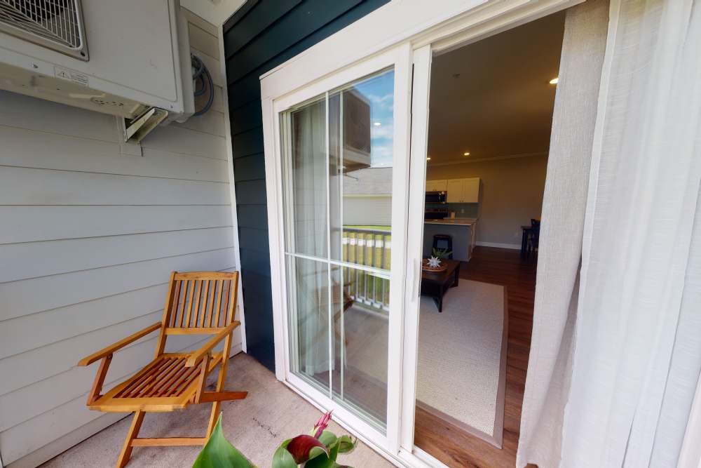 Cozy private balcony in a model home at Coastal Club Apartments in Brunswick, Georgia