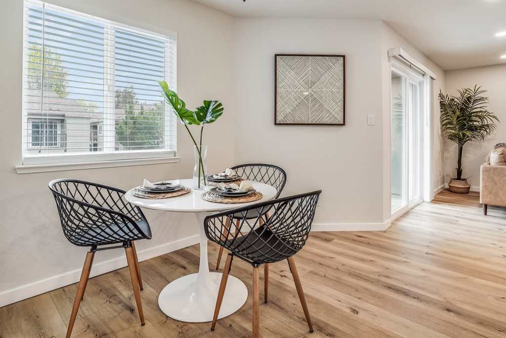 Small dining table by the window at Trails at 2112 in Modesto, California