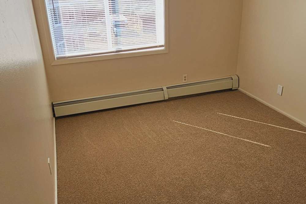 Bedroom with carpet flooring at Jewel Lake Villa in Anchorage, Alaska