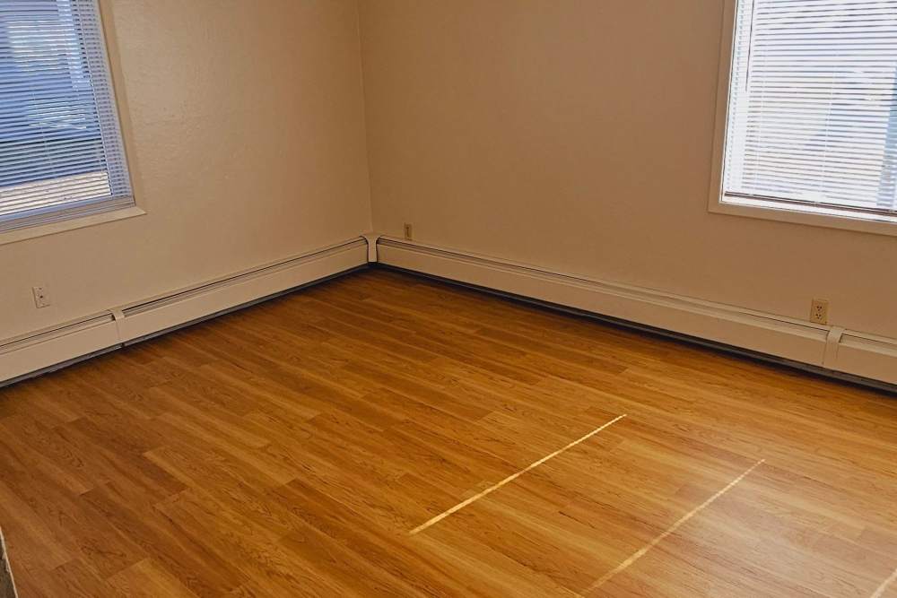 Model apartment with wood flooring at Jewel Lake Villa in Anchorage, Alaska
