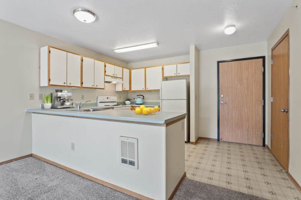 Kitchen with linoleum flooring at Gateway Plaza Apartments in Portland, Oregon
