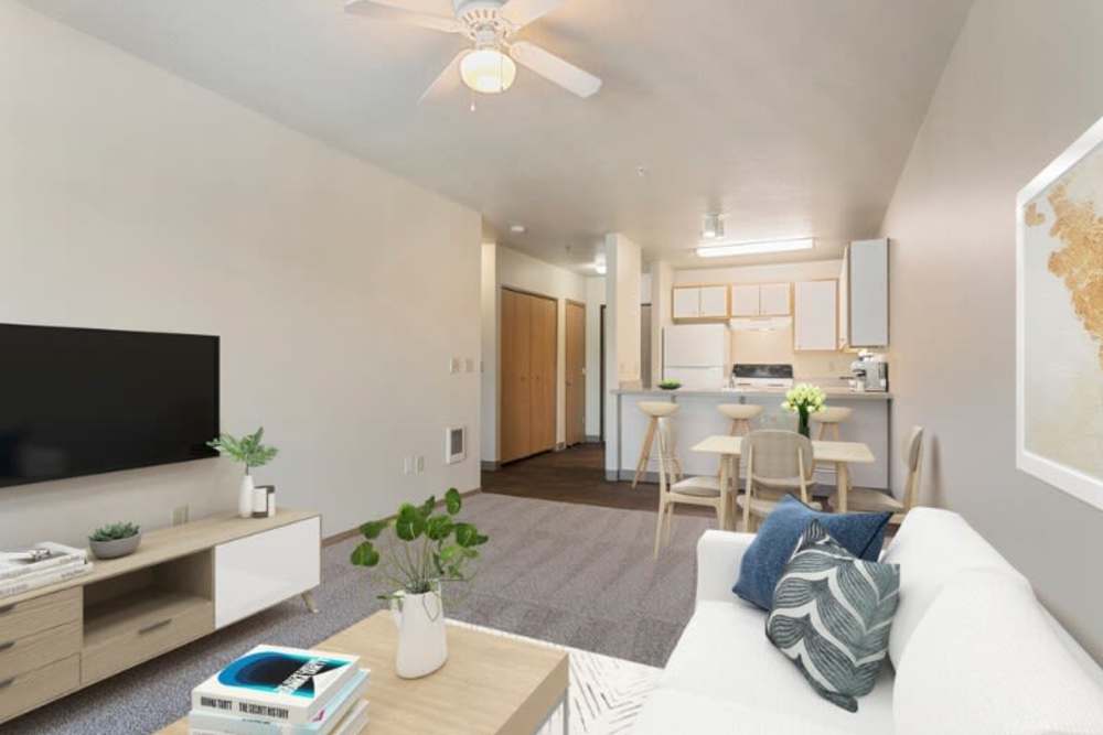 Spacious living room and kitchen at Ventura Park Plaza Apartments in Portland, Oregon