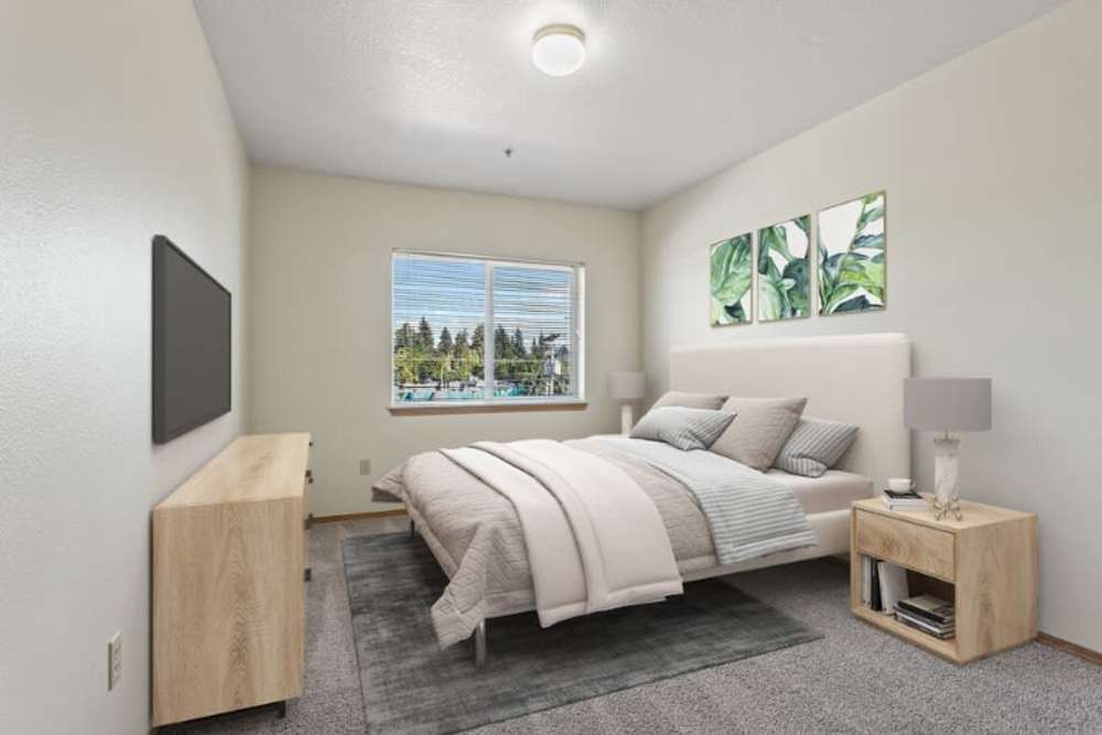 Cozy bedroom with two windows at Ventura Park Plaza Apartments in Portland, Oregon