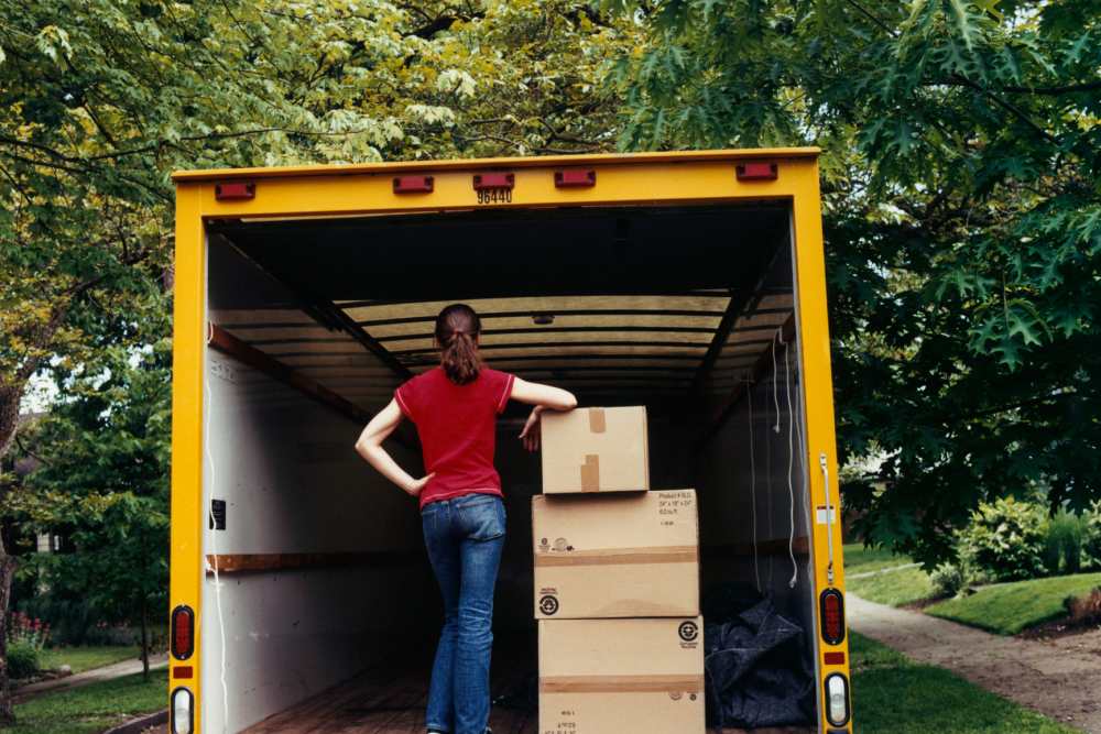 People moving boxes to storage at Cedartree Management Company in Vancouver, Washington