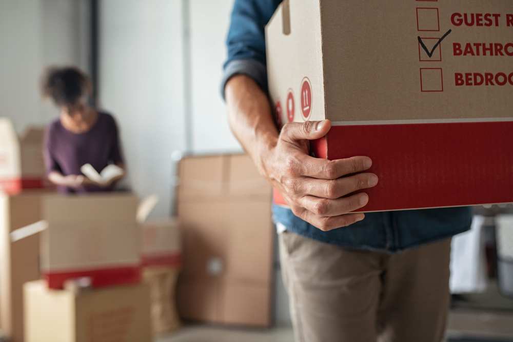 People moving boxes to storage at Cedartree Management Company