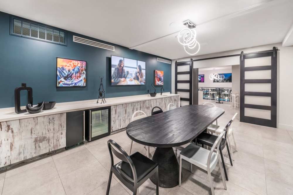 Community lounge with meeting table at Reno Experience District in Reno, Nevada