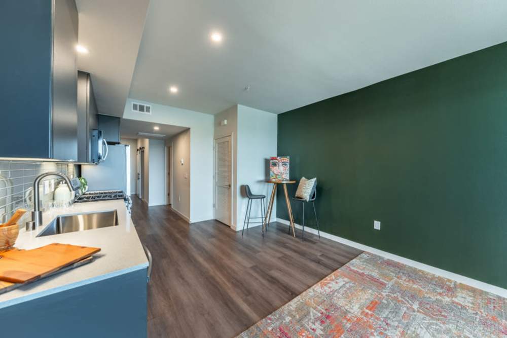 Model living space with blue accents at Reno Experience District in Reno,