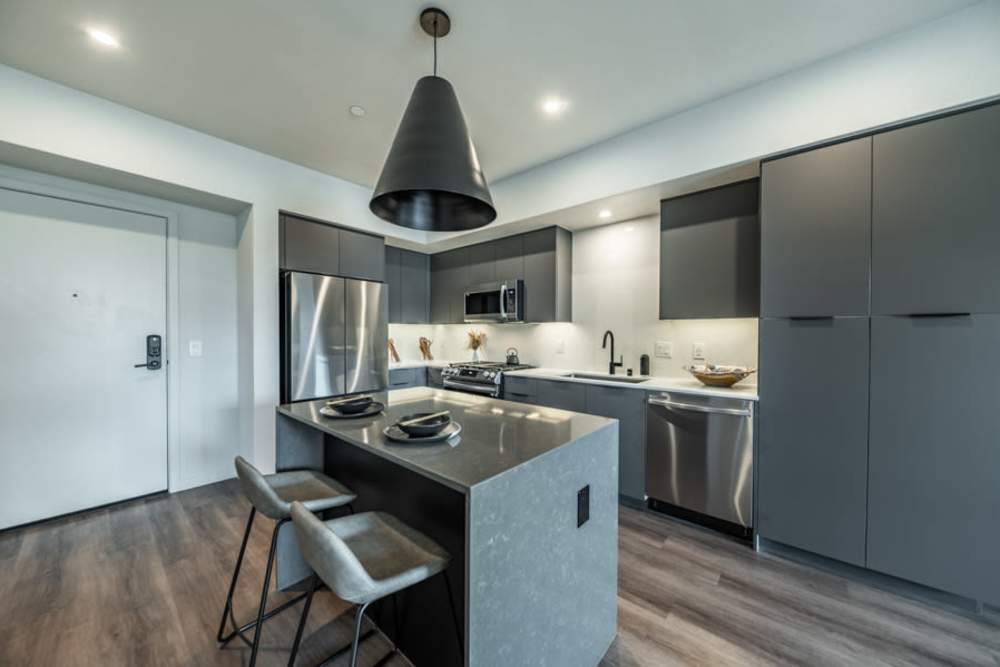 Master bedroom with ceiling fan at Reno Experience District in Reno,