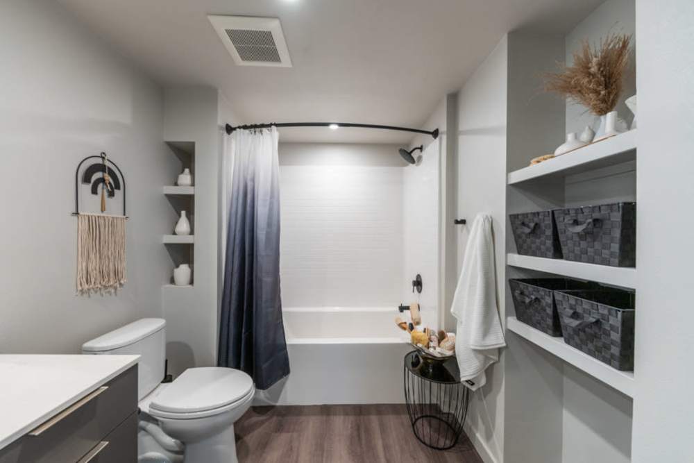 Bathroom with wood-style flooring at Reno Experience District in Reno, Nevada