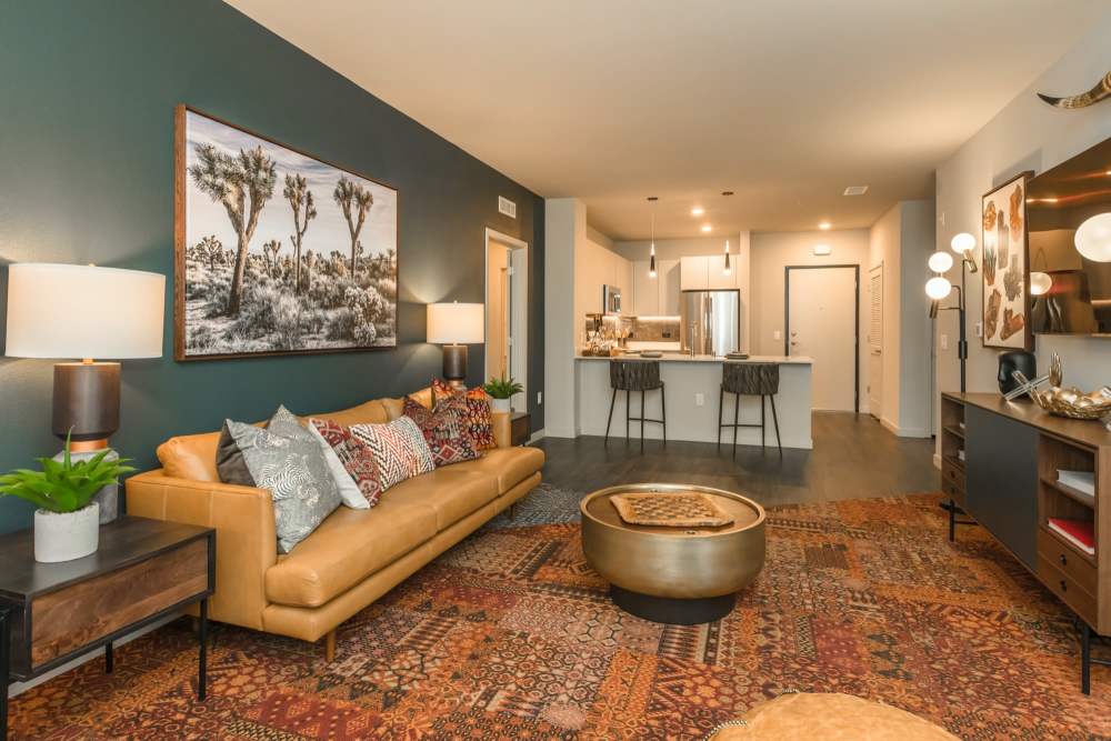Living room with a colorful rug at Reno Experience District in Reno,