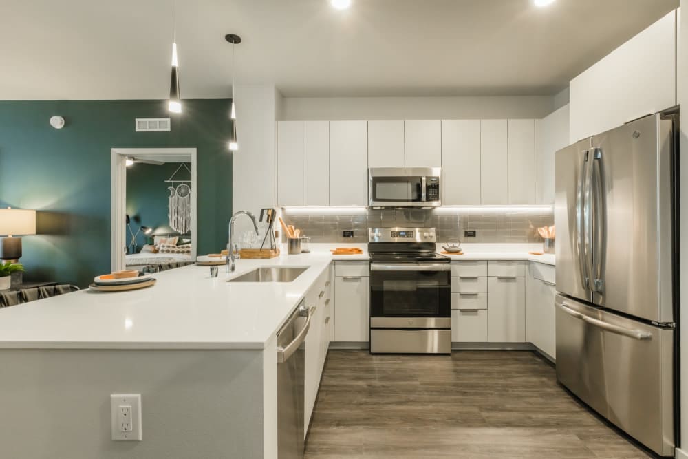 Kitchen with wood-style flooring at Reno Experience District in Reno, Nevada
