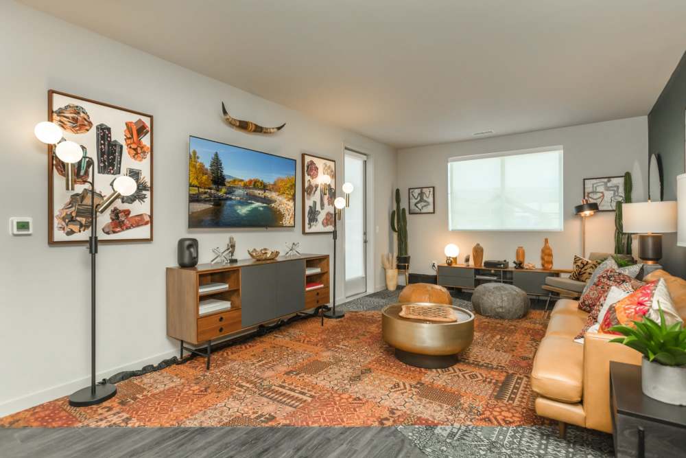 Living room with plank flooring at Reno Experience District in Reno,
