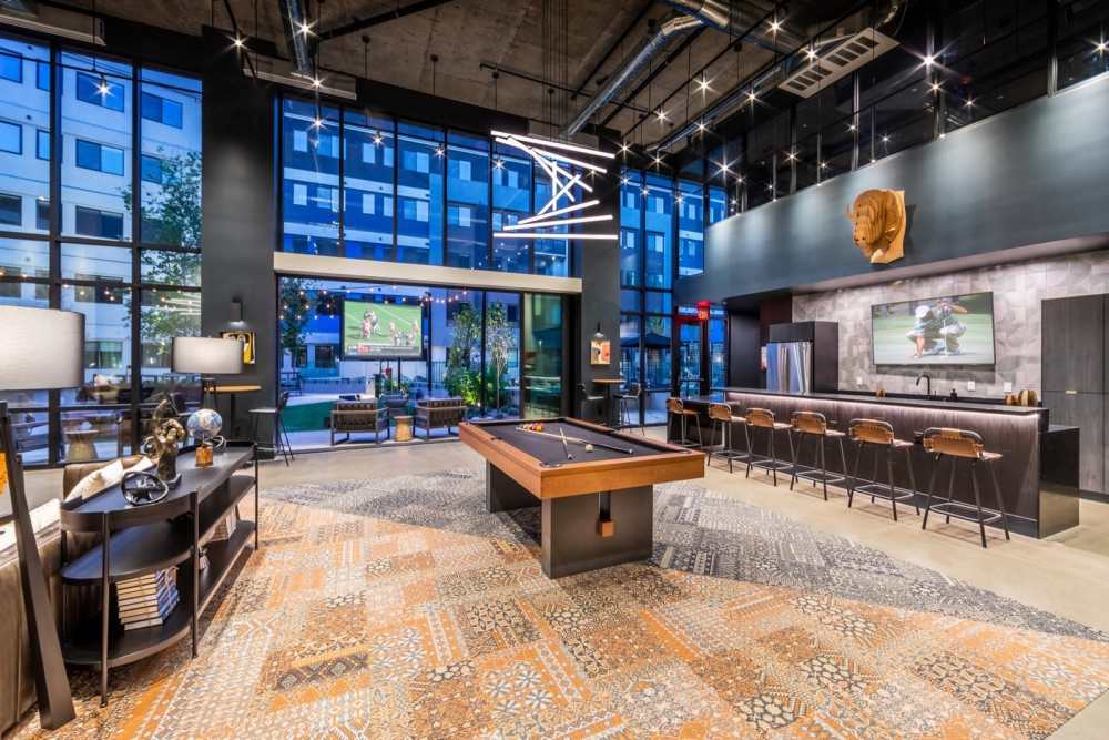 Resident lounge with seating and games at Reno Experience District in Reno, Nevada