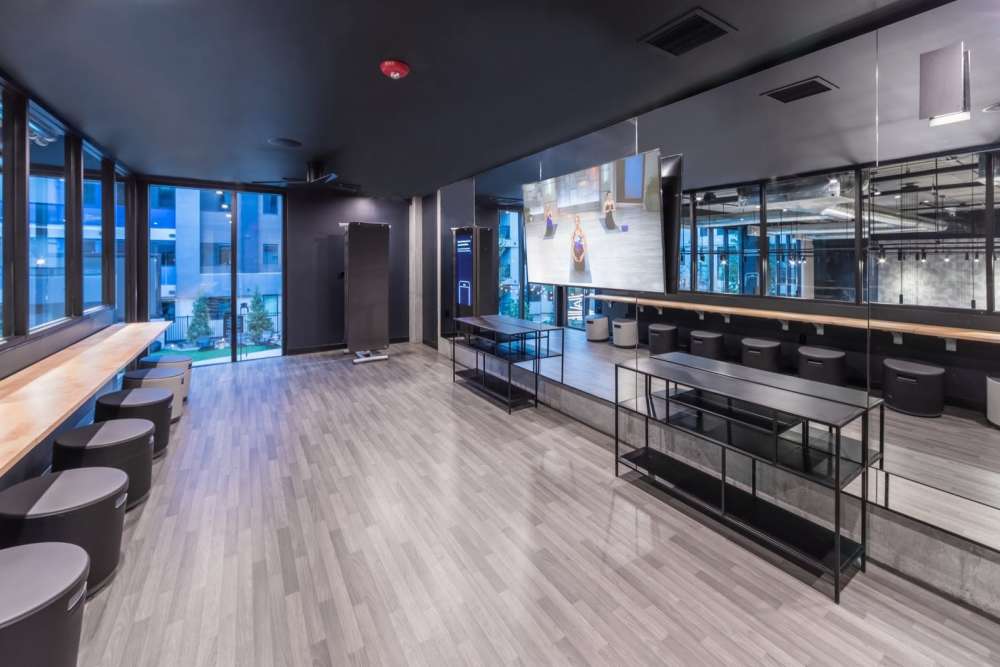 Fitness room with mirror at Reno Experience District in Reno, Nevada