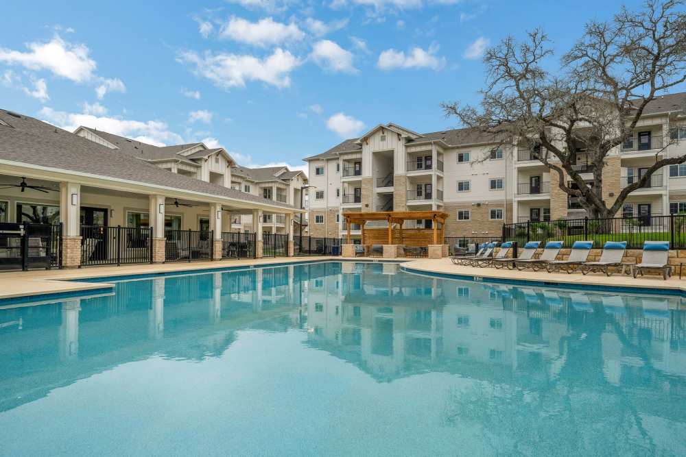 Wide angle shot of a pool and the place in THE RESIDENCES AT LANDON RIDGE, San Antonio, Texas