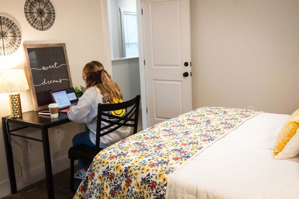 Resident studying in their room at College Town Oxford in Oxford, Mississippi