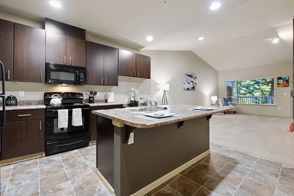 Spacious kitchen and living room at Yauger Park Villas in Olympia, Washington