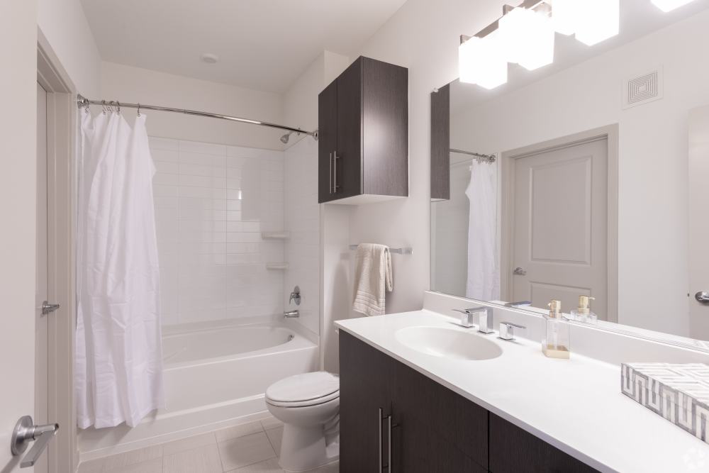 Big bathroom with white walls at Discovery Square in Herndon, Virginia