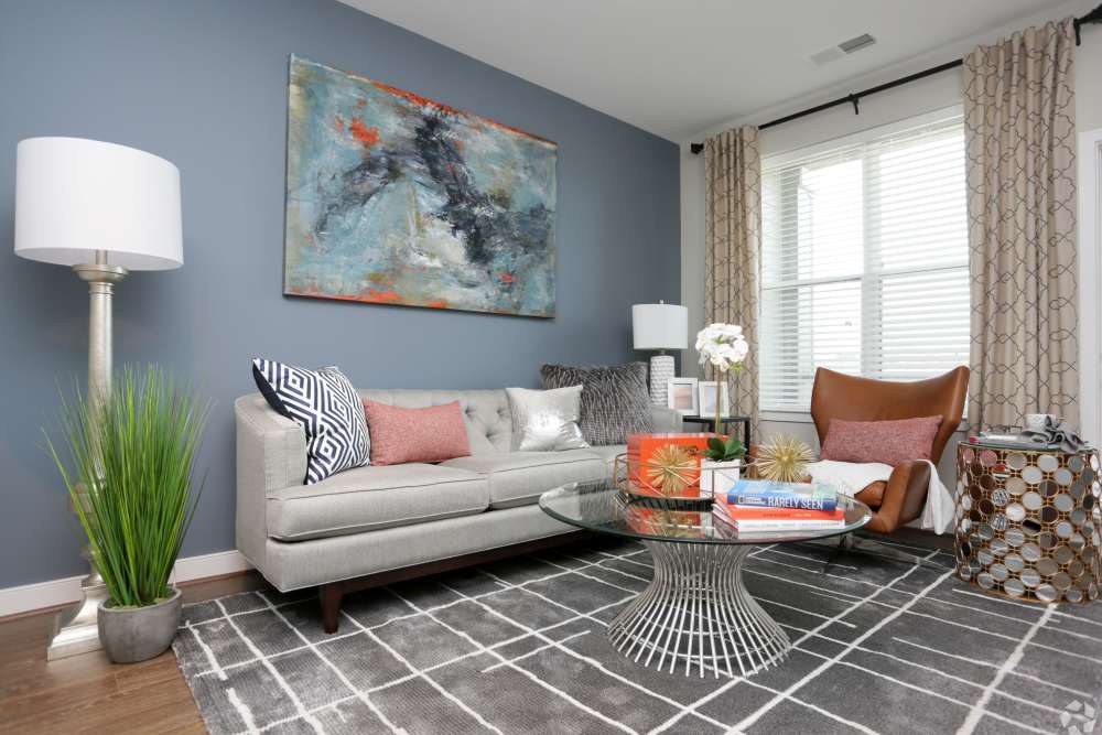 Big living room with blue walls at Discovery Square in Herndon, Virginia