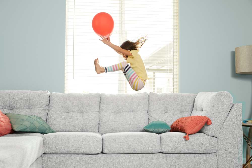child jumping on couch at Epperson in Wesley Chapel, Florida