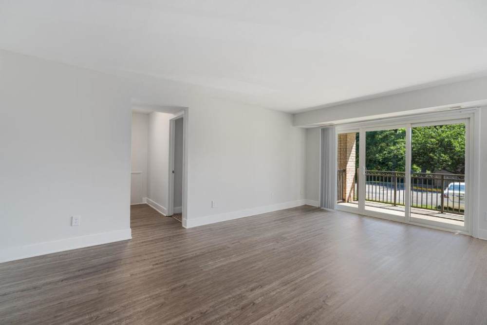 Open living room with white walls at South Port in Alexandria, Virginia