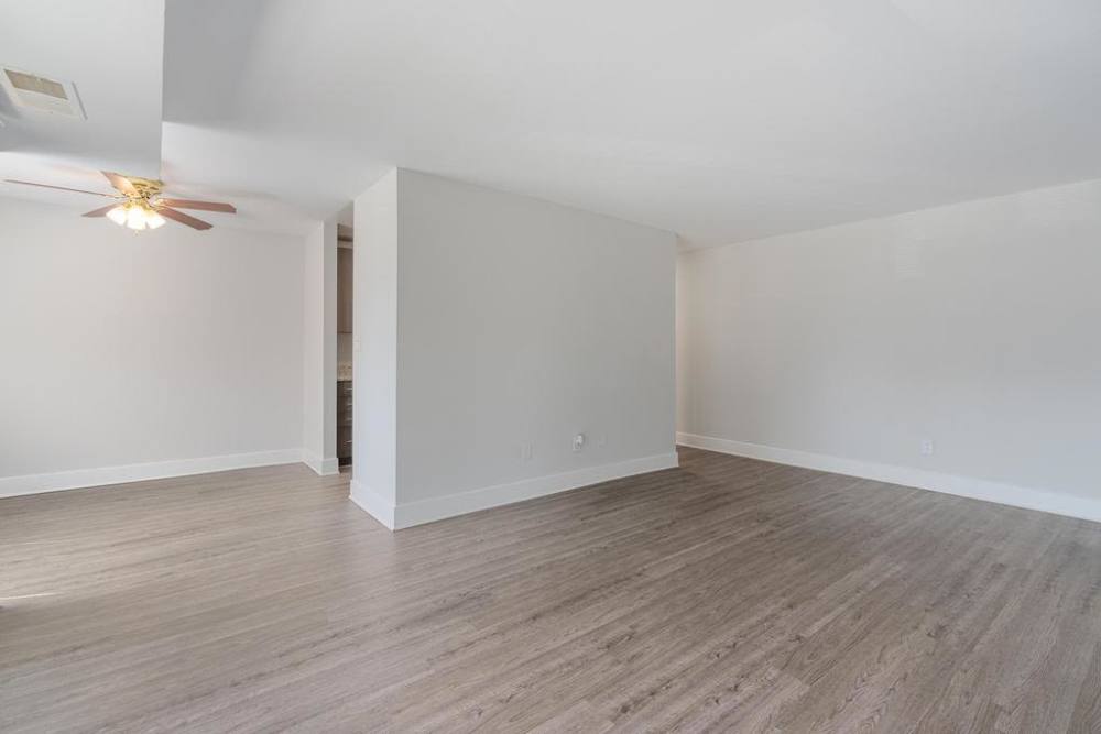 Large living space with wood floors at South Port in Alexandria, Virginia