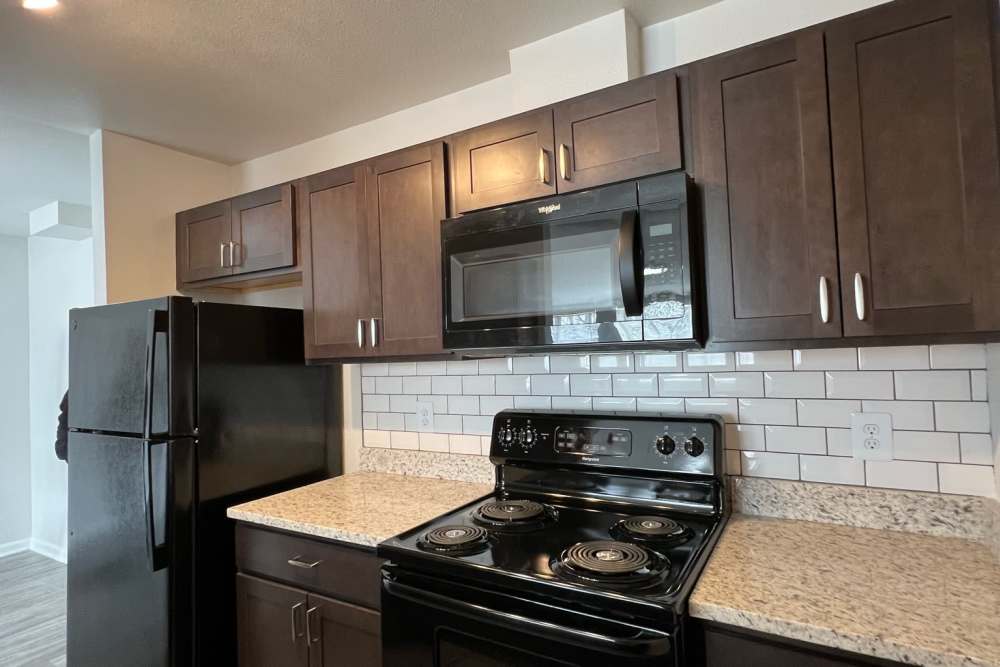 Model kitchen with dark cabnites at Montgomery Club in Gaithersburg, Maryland