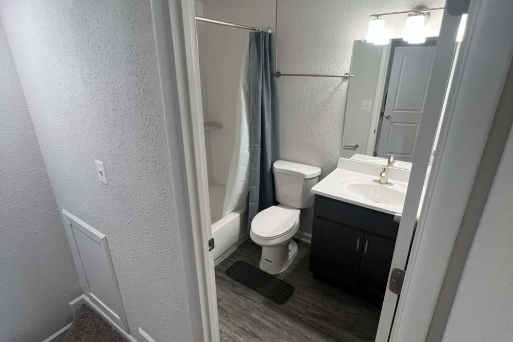 Model bathroom with a large mirror at Montgomery Club in Gaithersburg, Maryland