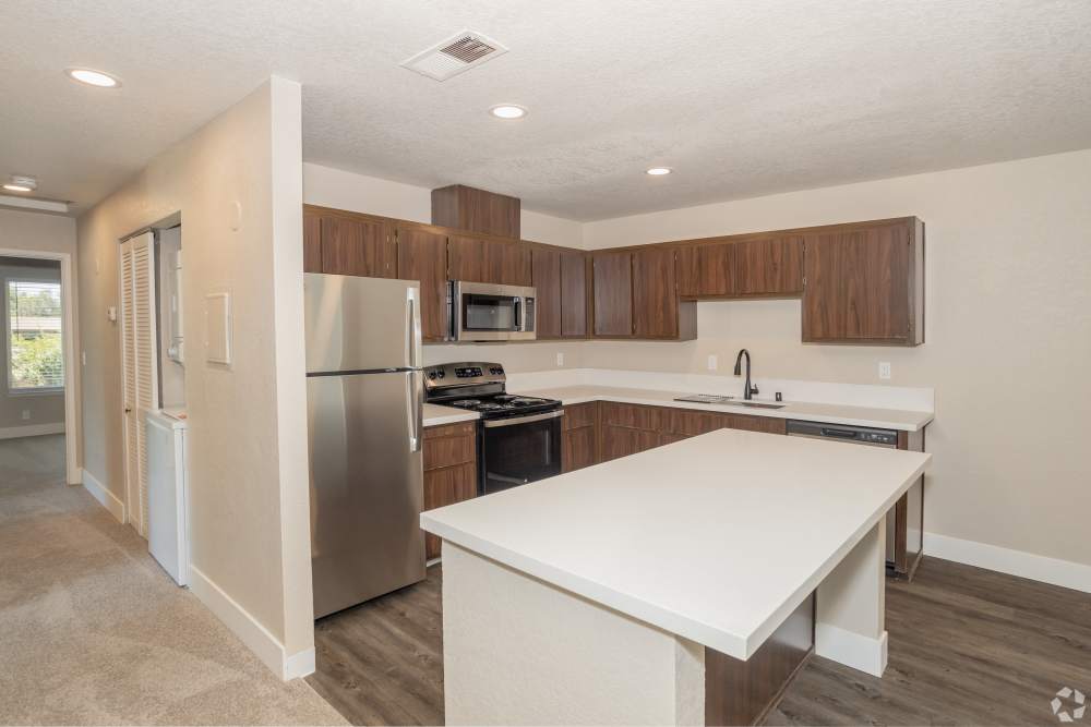 Wider shot of the Kitchen with Island Bar at El Macero Apartments in Davis, California