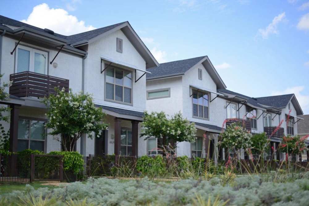 Parkside townhomes on town's outskirts at Flatiron District at Austin Ranch, The Colony, Texas