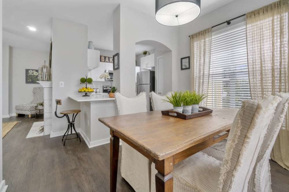 Dining area with a table and chairs in a well-lit kitchen space at Flatiron District at Austin Ranch, The Colony, Texas