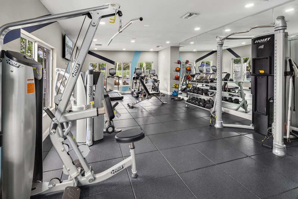 Community gym with weight equipment at Boynton Place Apartments in Boynton Beach, Florida