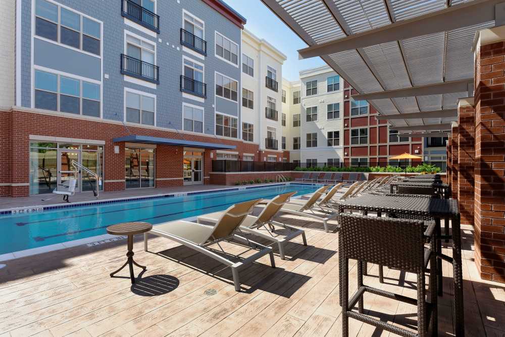 Large pool with lounge chairs at 3350 at Alterra in Hyattsville, Maryland