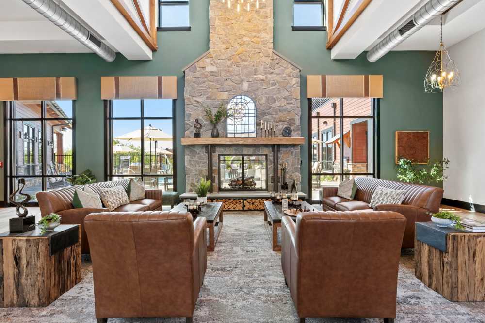 Community lounge with a fire place at Upper East in Frederick, Maryland